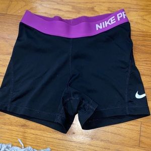 Black and purple Nike pros